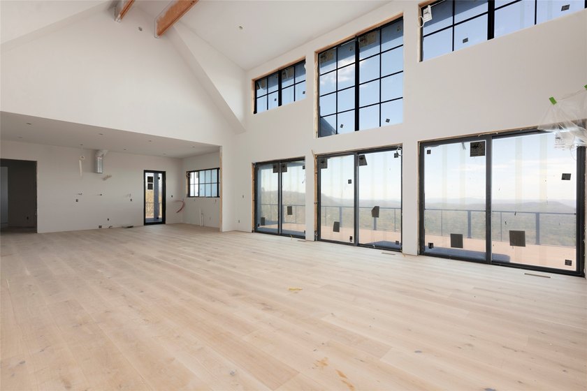Perched high above Lake Toxaway, this exquisite new-construction - photo 4