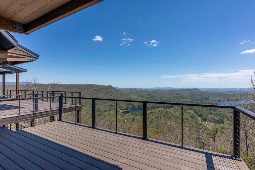 Perched high above Lake Toxaway, this exquisite new-construction - photo 9