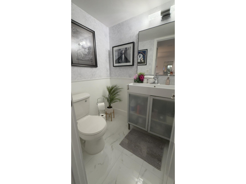 Bright and inviting 1-bedroom, 1.5-bath condo located less than - photo 14
