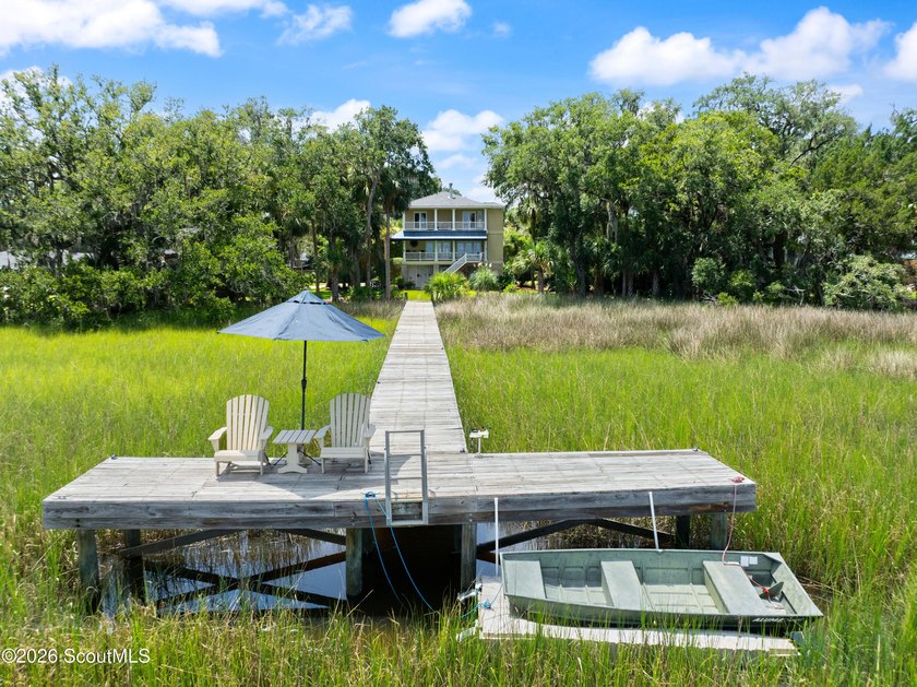 Your coastal oasis awaits! Exceptionally maintained custom-built - photo 6