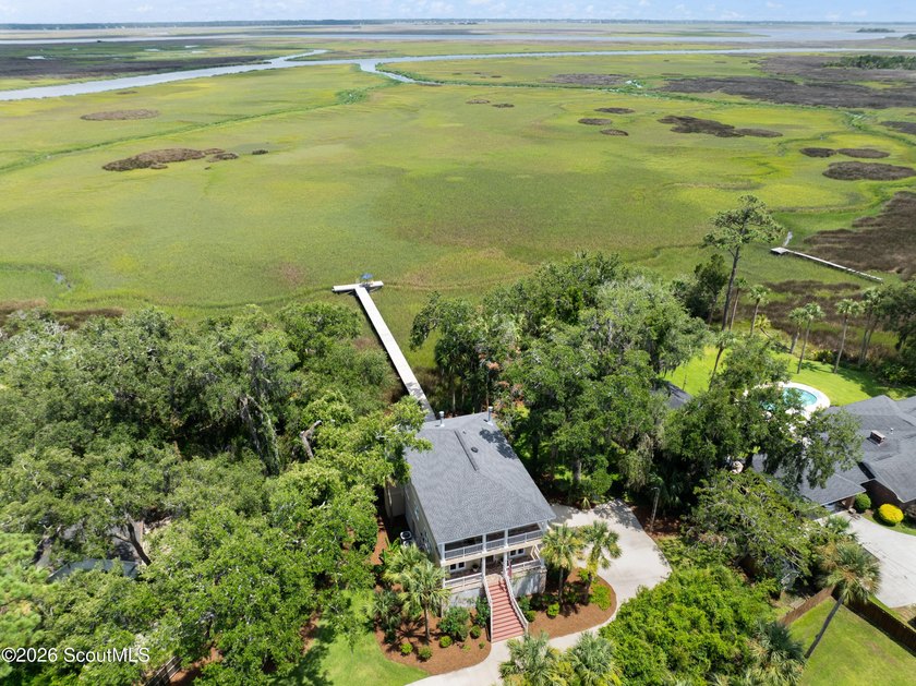 Your coastal oasis awaits! Exceptionally maintained custom-built - photo 7