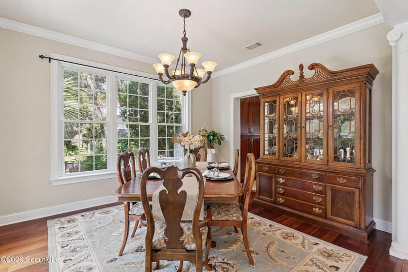 Your coastal oasis awaits! Exceptionally maintained custom-built - photo 9