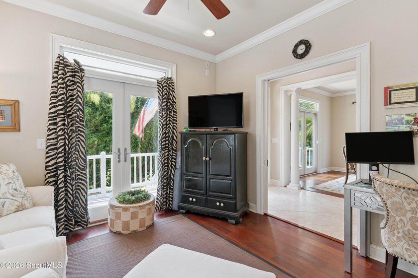 Your coastal oasis awaits! Exceptionally maintained custom-built - photo 10