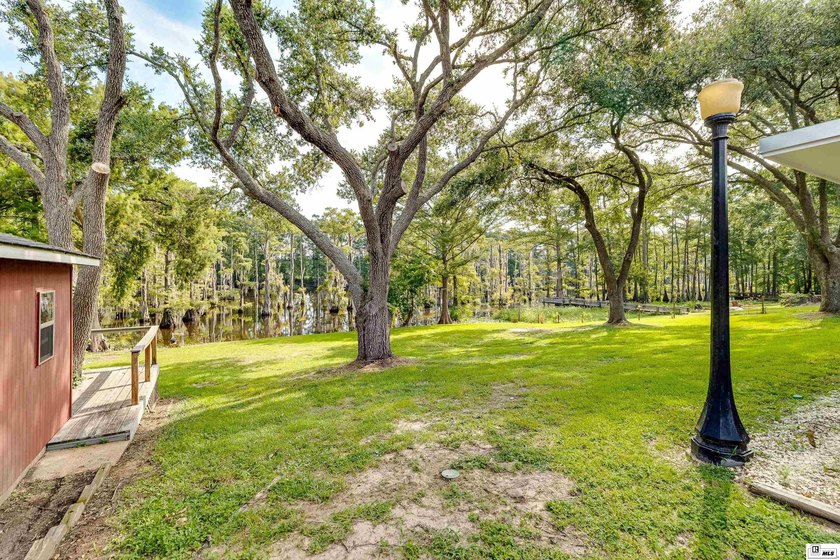 Experience peaceful bayou front living in this beautiful - photo 33