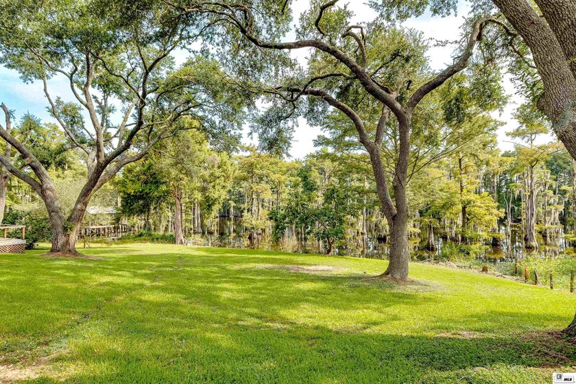 Experience peaceful bayou front living in this beautiful - photo 34