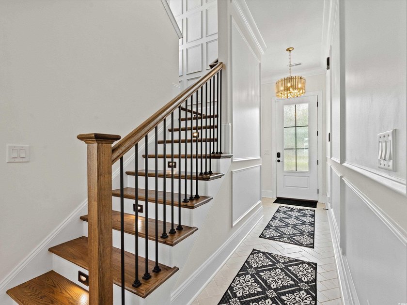 Located in the gated Ocean Villas at 67th community, home to - photo 3
