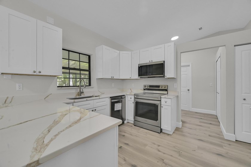 Welcome home to this beautifully remodeled residence nestled in - photo 11