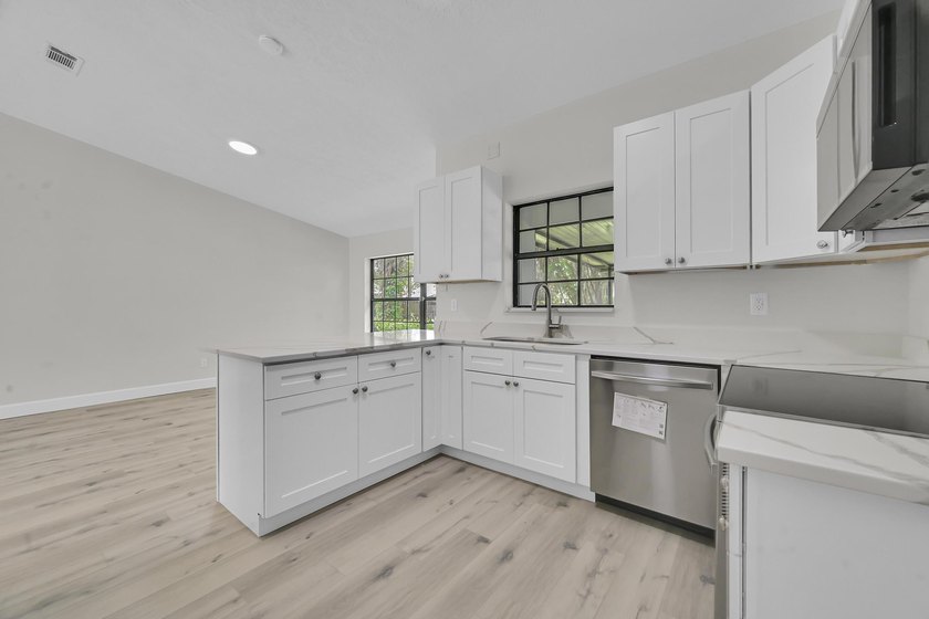 Welcome home to this beautifully remodeled residence nestled in - photo 12