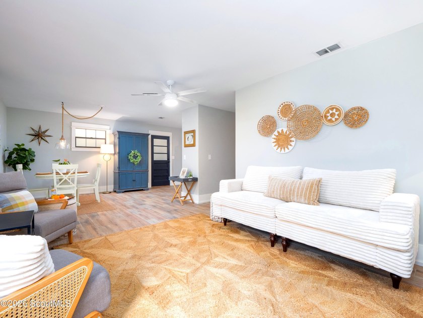 Embrace casual beach town living in this beautifully renovated - photo 3