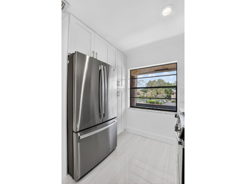 ABSOLUTELY STUNNING FULLY RENOVATED CONDO | BOCA LAGO COMMUNITY - photo 14