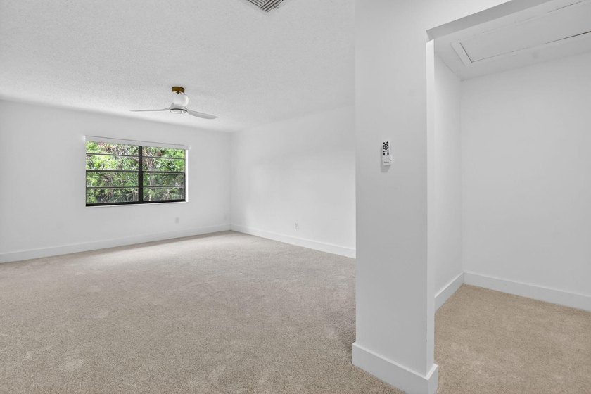 ABSOLUTELY STUNNING FULLY RENOVATED CONDO | BOCA LAGO COMMUNITY - photo 17