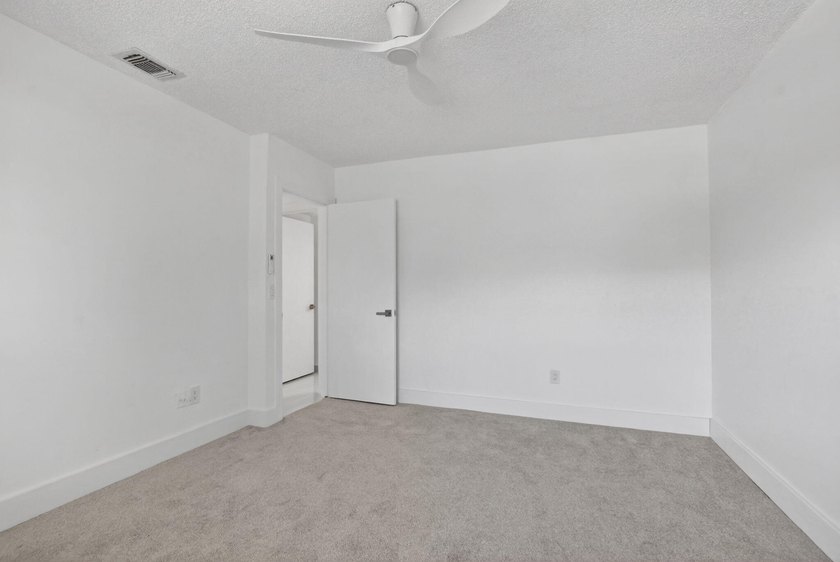 ABSOLUTELY STUNNING FULLY RENOVATED CONDO | BOCA LAGO COMMUNITY - photo 22