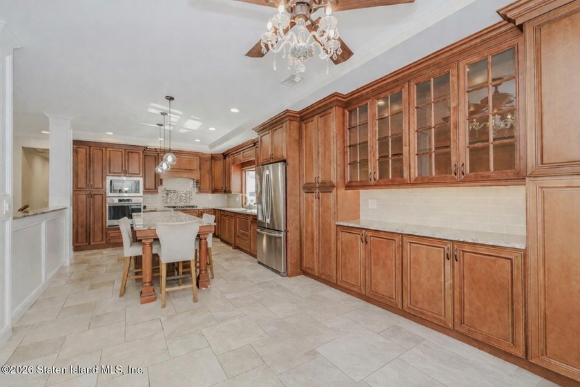 Welcome to this custom-built two-family detached home! This - photo 6