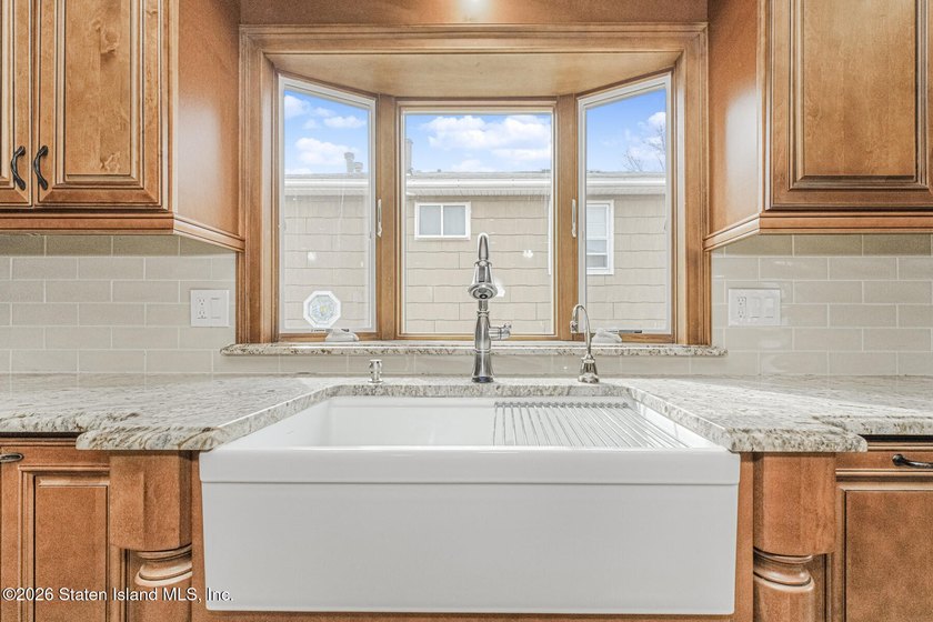 Welcome to this custom-built two-family detached home! This - photo 8