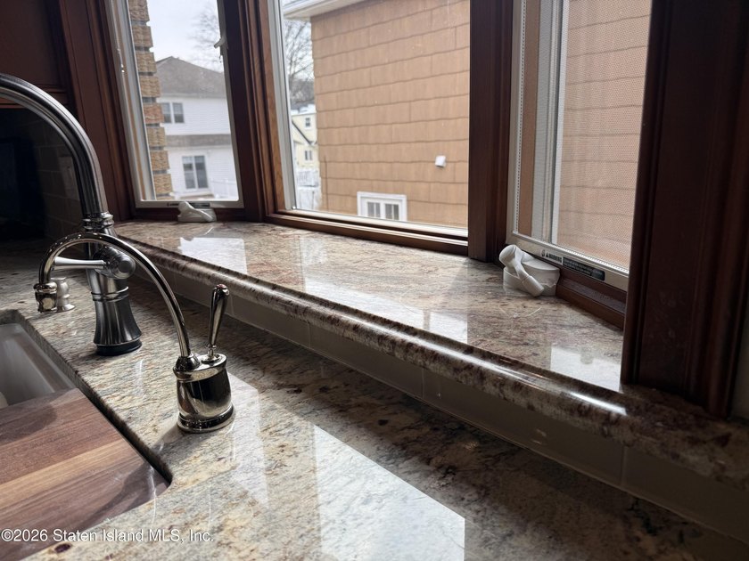 Welcome to this custom-built two-family detached home! This - photo 9