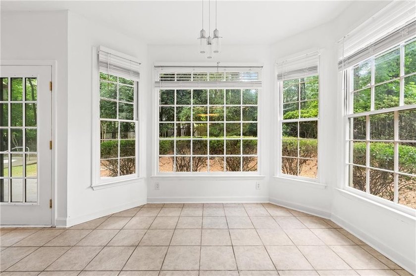 Welcome home to this beautifully maintained brick-front - photo 12