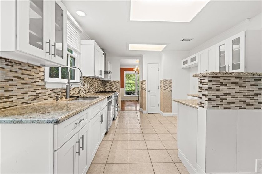 Welcome home to this beautifully maintained brick-front - photo 14