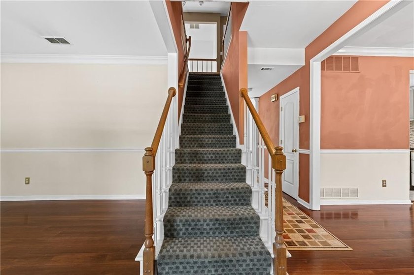 Welcome home to this beautifully maintained brick-front - photo 16