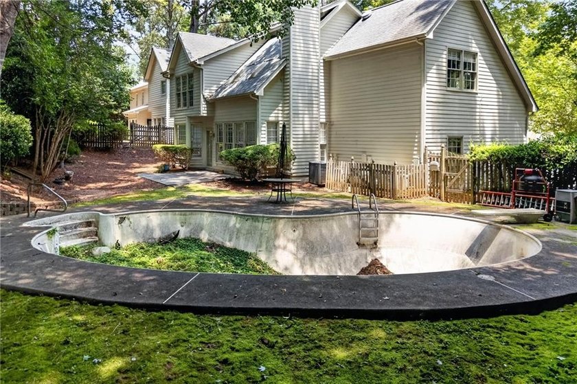 Welcome home to this beautifully maintained brick-front - photo 33