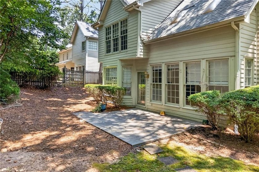 Welcome home to this beautifully maintained brick-front - photo 34