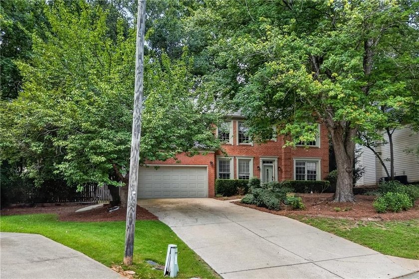 Welcome home to this beautifully maintained brick-front - photo 38