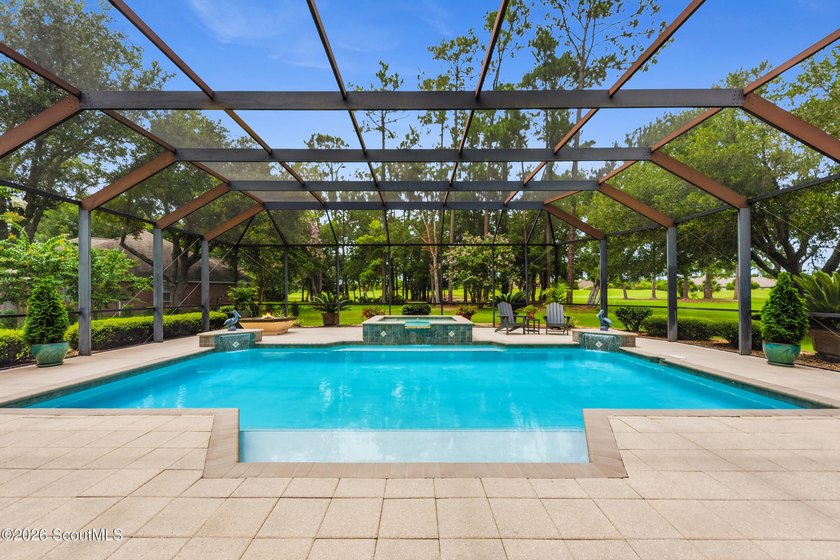 Welcome home to 5 Sandhill Crane Drive, a stunning custom-built - photo 3