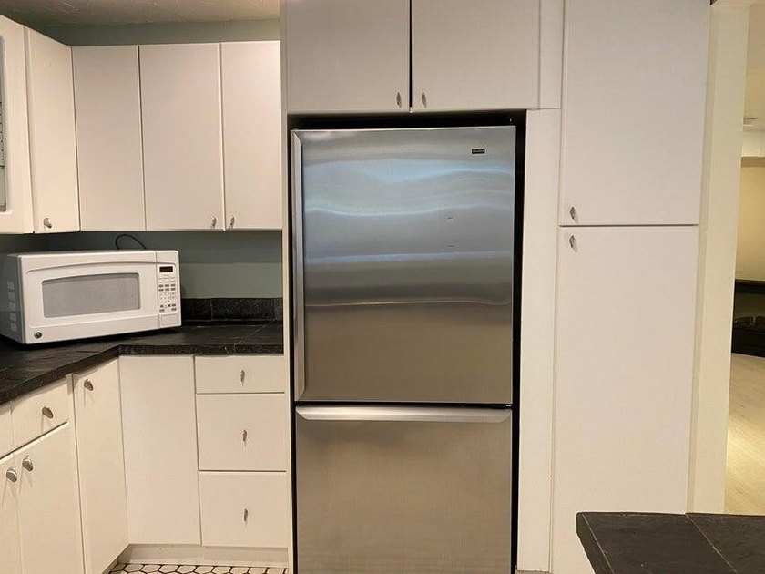 Three-level condominium offering space, flexibility, and a prime - photo 9