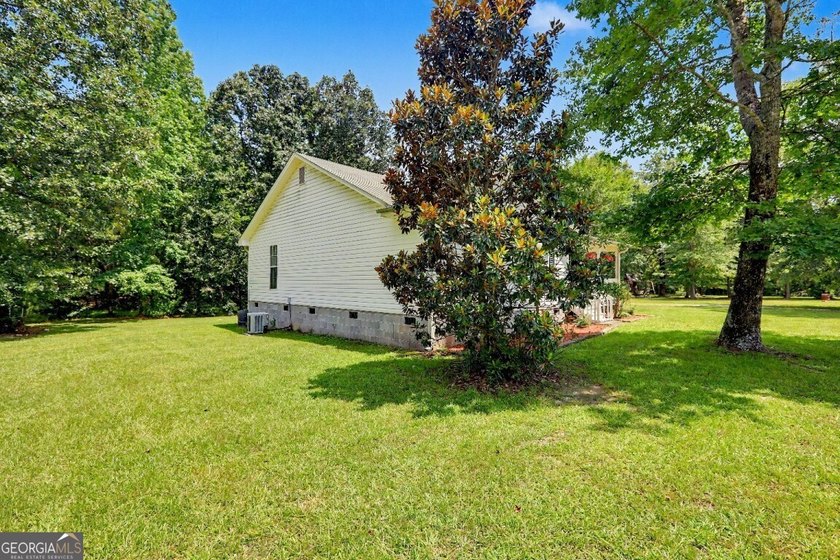 Welcome home to this charming ranch-style property offering the - photo 3