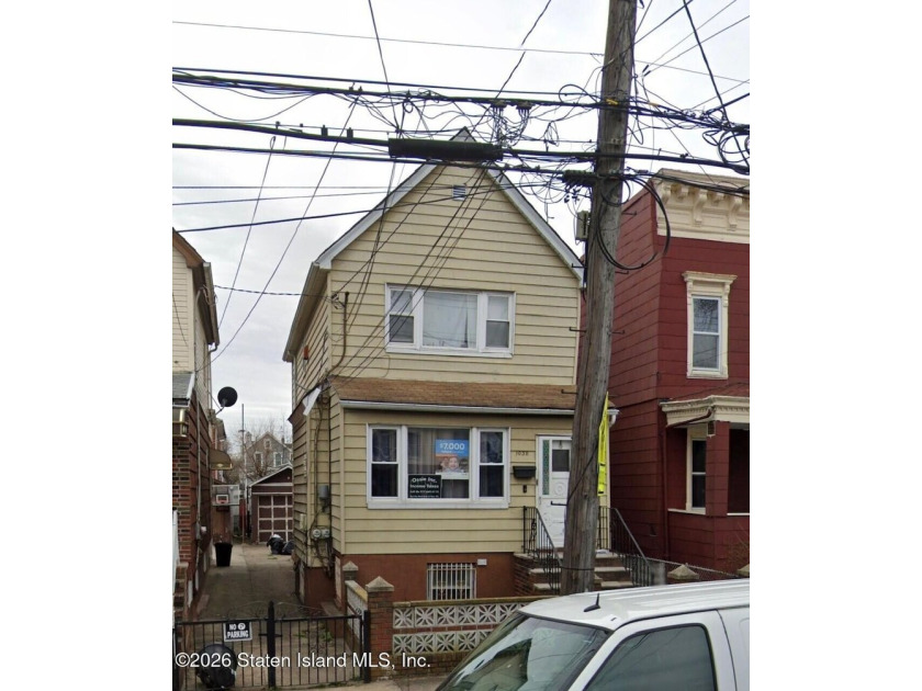 Two-family home in Canarsie featuring two 2-bedroom, 1-bath - photo 3