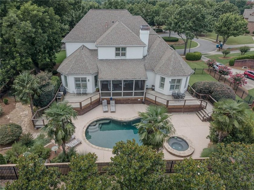 Nestled on a private cul-de-sac within the prestigious gates of - photo 4