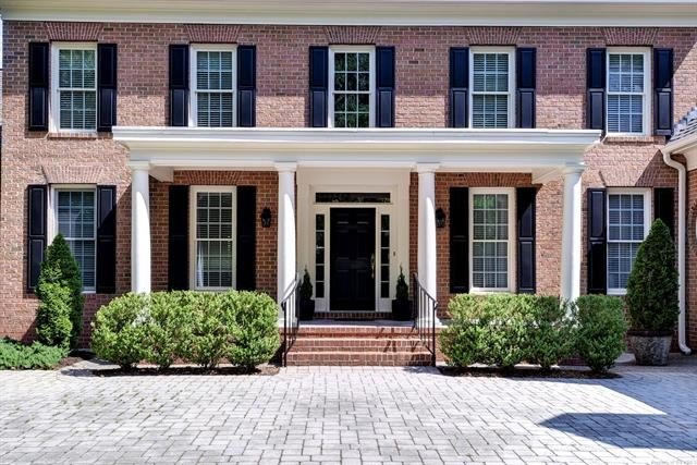 This all-brick colonial sits on a private end lot and offers a - photo 2