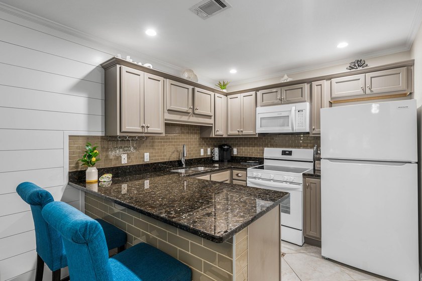 Welcome to Grand Caribbean West Unit 214, a turnkey, fully - photo 10