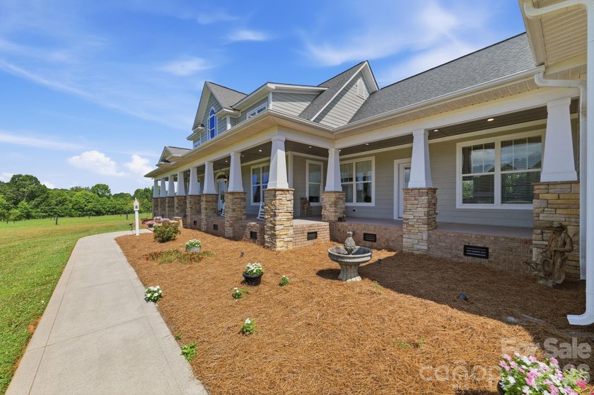 Just beyond a gated entrance and surrounded by beautifully - photo 4