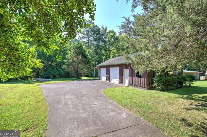Nestled on 2.83 beautifully landscaped acres surrounded by - photo 50