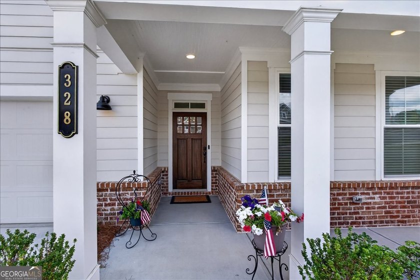 Welcome to 328 McQueen Way in Courtyards at Hickory Flat, a - photo 3