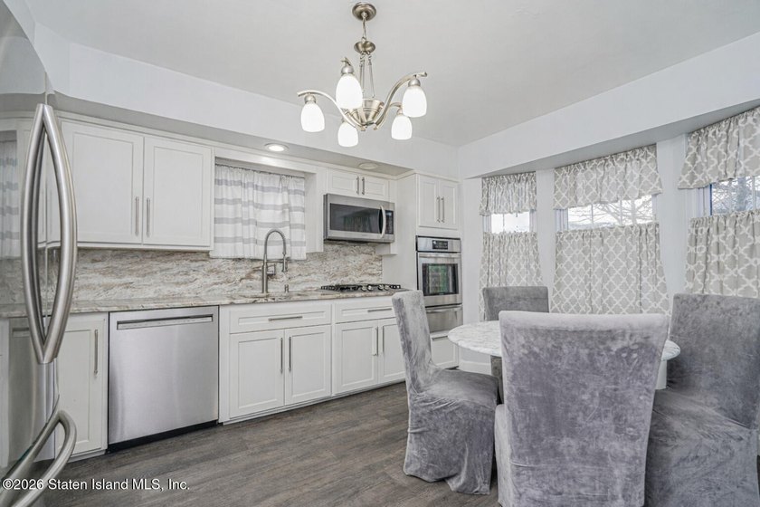 Welcome to 25 Morgan Lane, a charming brick home located in the - photo 8