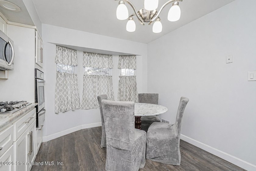 Welcome to 25 Morgan Lane, a charming brick home located in the - photo 9