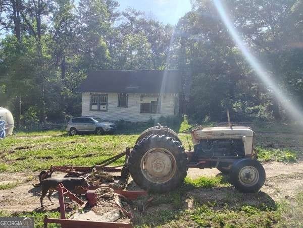 Rare 9.5-Acre Haven with Spring-Fed Pond, Multiple Structures &amp; - photo 6