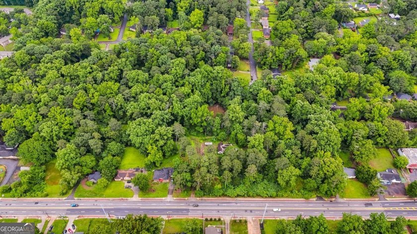 Rare 9.5-Acre Haven with Spring-Fed Pond, Multiple Structures &amp; - photo 7