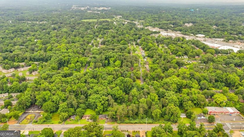 Rare 9.5-Acre Haven with Spring-Fed Pond, Multiple Structures &amp; - photo 9