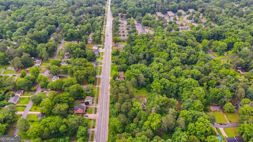 Rare 9.5-Acre Haven with Spring-Fed Pond, Multiple Structures &amp; - photo 10