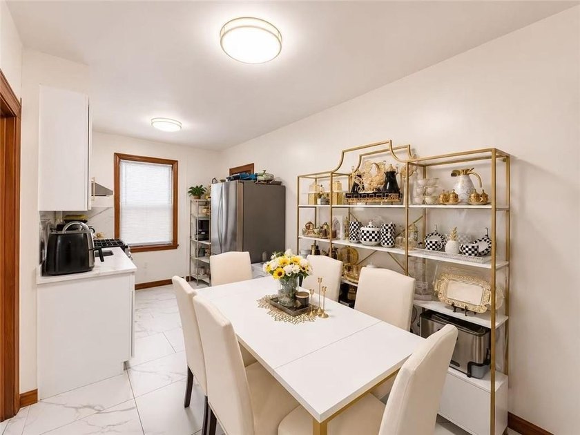 Welcome to this spacious and well maintained 2-family brick home - photo 3