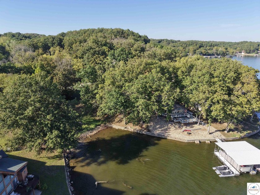 Discover the potential of this quaint two-bedroom cabin, nestled - photo 3