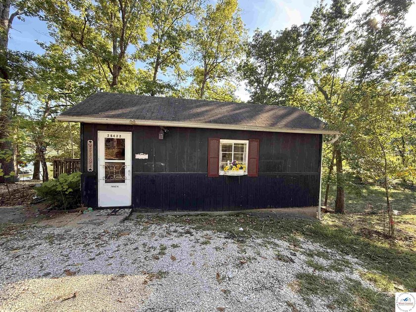 Discover the potential of this quaint two-bedroom cabin, nestled - photo 10
