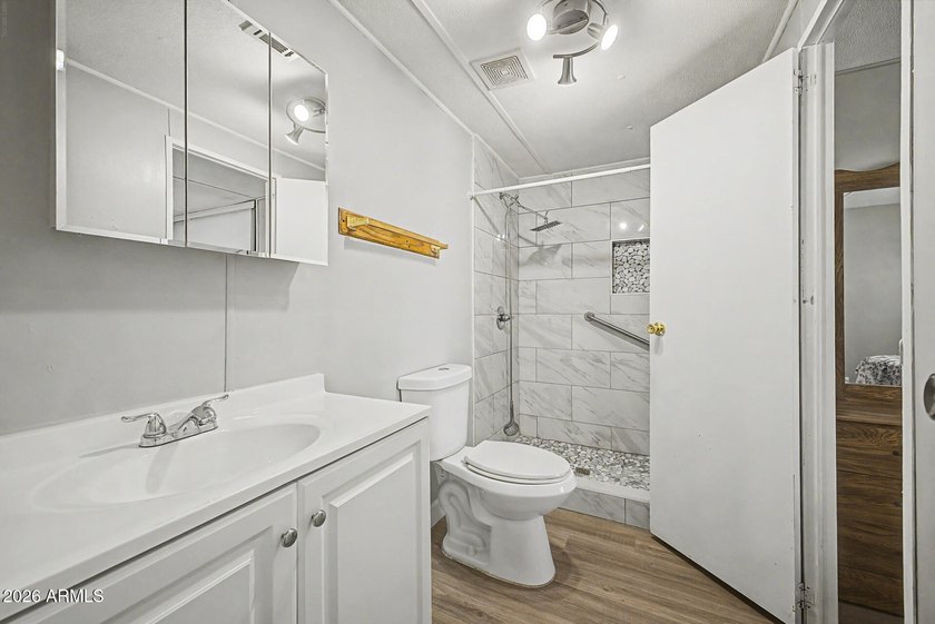 Welcome home! This charming 3-bedroom, 2-bath mobile home greets - photo 21