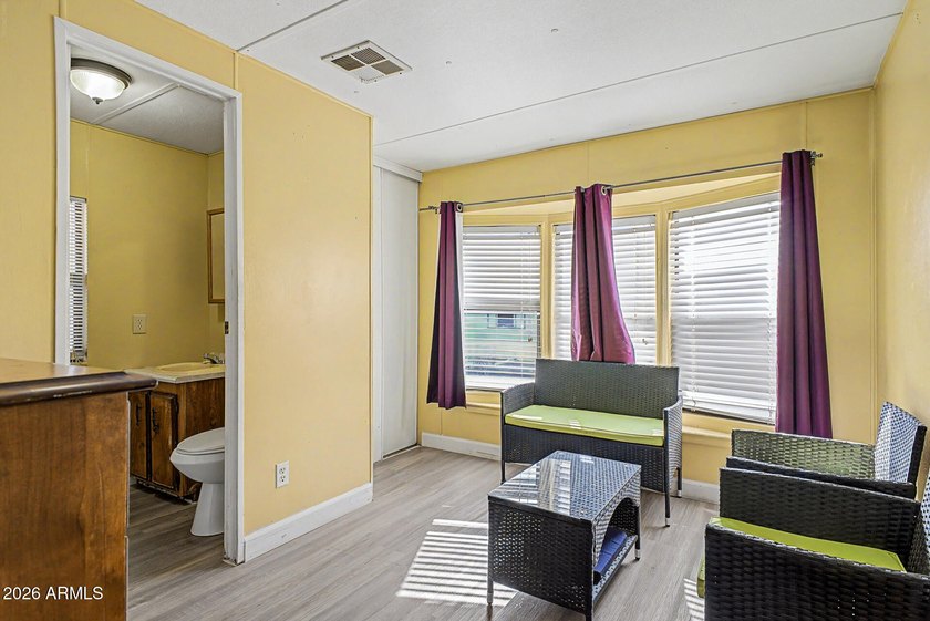 Welcome home! This charming 3-bedroom, 2-bath mobile home greets - photo 25