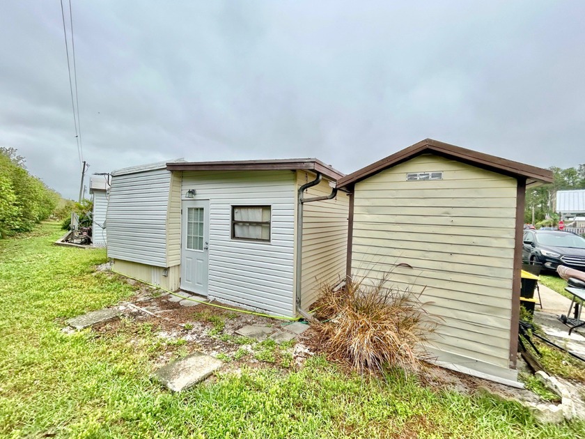 This mobile home is located in a peaceful 55+ community and - photo 13