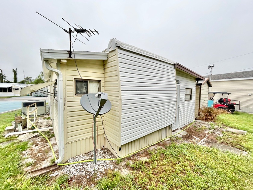 This mobile home is located in a peaceful 55+ community and - photo 15