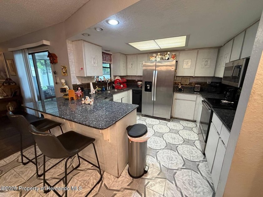 Welcome to this spacious 3-bedroom, 2-bath home featuring a - photo 16