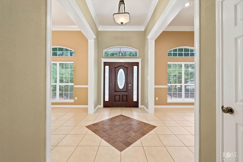 This beautiful home offers spacious living with soaring ceilings - photo 9